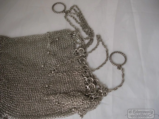 Mesh finger bag. Silver. Fringes and balls. Chain. Circa 1920's
