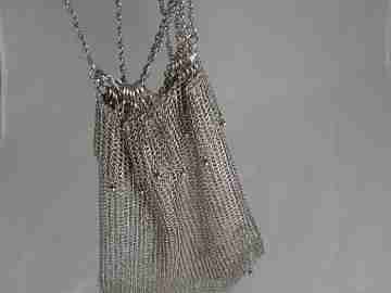 Mesh finger bag. Silver. Fringes and balls. Chain. Circa 1920's