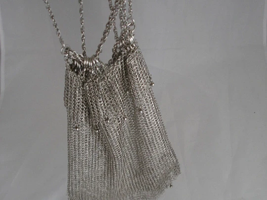 Mesh finger bag. Silver. Fringes and balls. Chain. Circa 1920's