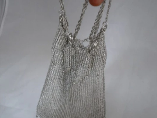 Mesh finger bag. Silver. Fringes and balls. Chain. Circa 1920's