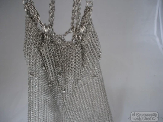 Mesh finger bag. Silver. Fringes and balls. Chain. Circa 1920's