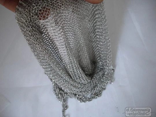 Mesh finger bag. Silver. Fringes and balls. Chain. Circa 1920's