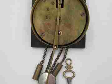 Miniature wall clock. Gold plated and polychromed wood. 1940's