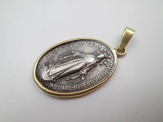Miraculous Virgin Medal. 925 sterling silver. 18 karat gold edge and ring. Spain. 1940's