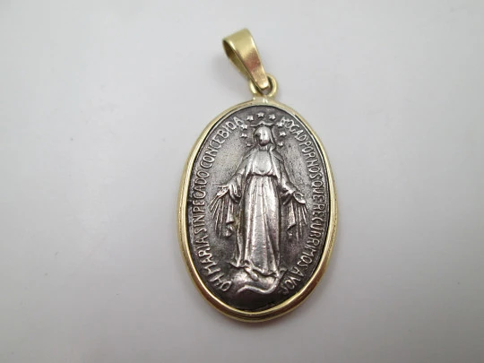 Miraculous Virgin Medal. 925 sterling silver. 18 karat gold edge and ring. Spain. 1940's