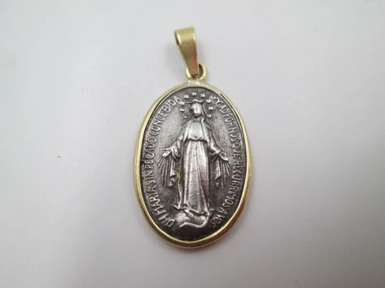 Miraculous Virgin Medal. 925 sterling silver. 18 karat gold edge and ring. Spain. 1940's