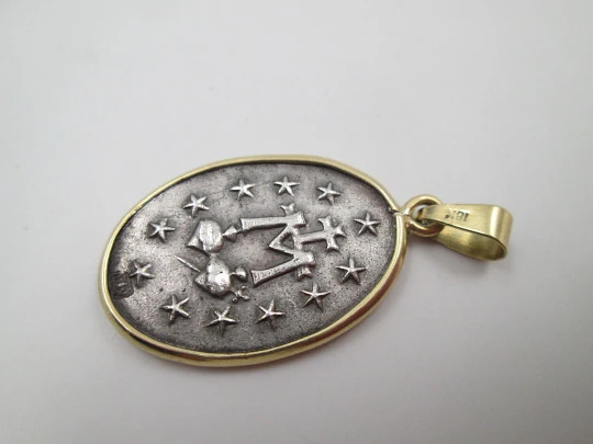 Miraculous Virgin Medal. 925 sterling silver. 18 karat gold edge and ring. Spain. 1940's