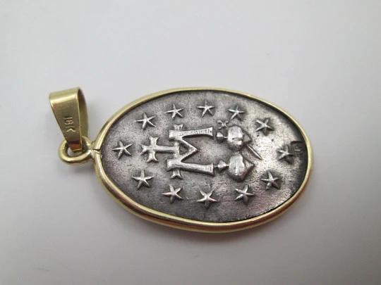 Miraculous Virgin Medal. 925 sterling silver. 18 karat gold edge and ring. Spain. 1940's