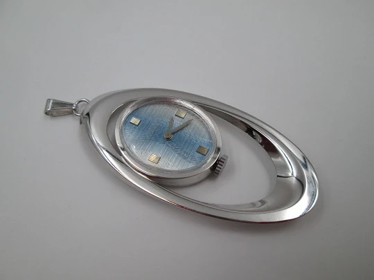 Mortima pendant watch. Silver plated metal. Bitone dial. Elliptical shape. France. 1970's