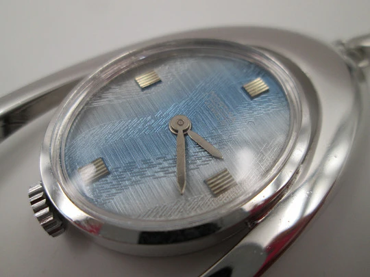 Mortima pendant watch. Silver plated metal. Bitone dial. Elliptical shape. France. 1970's