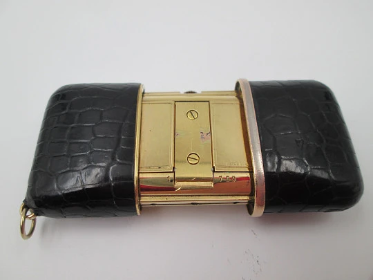 Movado Ermetoscope travel watch. Gold plated metal and crocodile skin. Calendar. 1950's