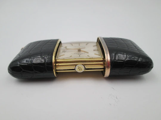 Movado Ermetoscope travel watch. Gold plated metal and crocodile skin. Calendar. 1950's