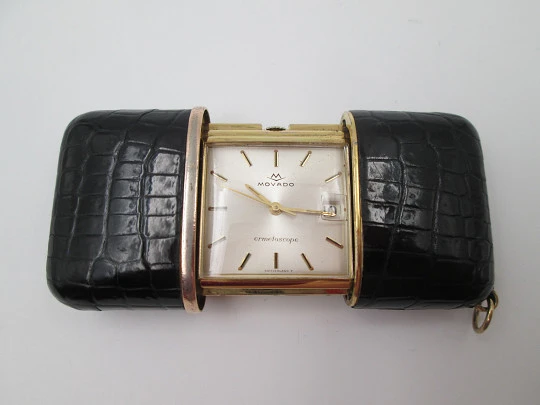 Movado Ermetoscope travel watch. Gold plated metal and crocodile skin. Calendar. 1950's