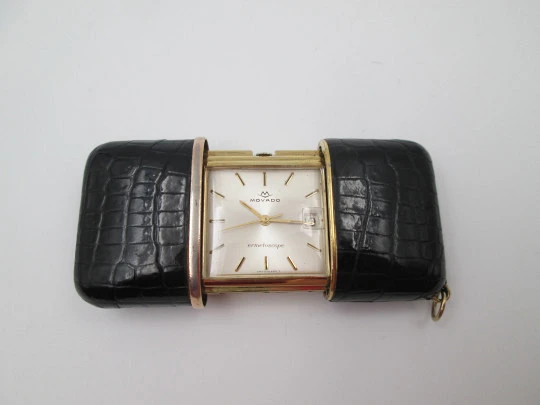 Movado Ermetoscope travel watch. Gold plated metal and crocodile skin. Calendar. 1950's