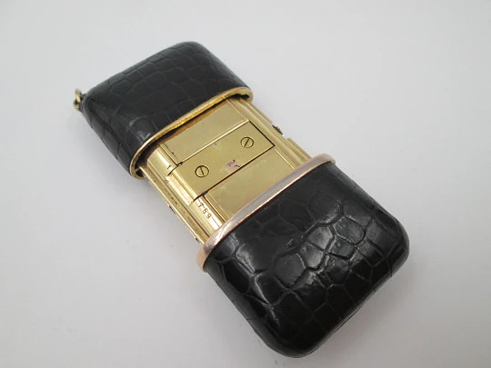 Movado Ermetoscope travel watch. Gold plated metal and crocodile skin. Calendar. 1950's