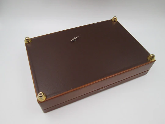 Musical tobacco table desk box. Wood and brown leather. Manual wind. Europe. 1970's Musical tobacco table desk box. Wood and brown leather. Manual wind. Europe. 1970's