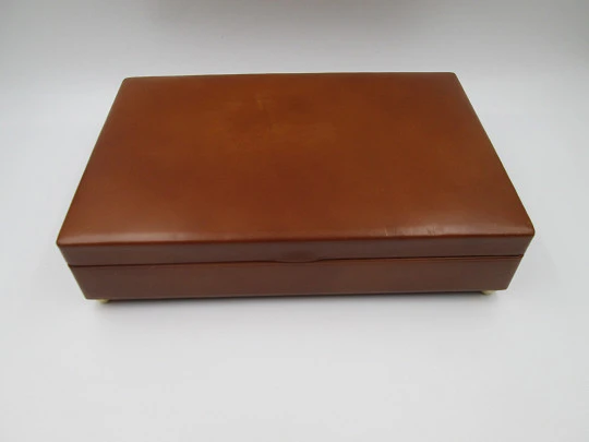 Musical tobacco table desk box. Wood and brown leather. Manual wind. Europe. 1970's Musical tobacco table desk box. Wood and brown leather. Manual wind. Europe. 1970's