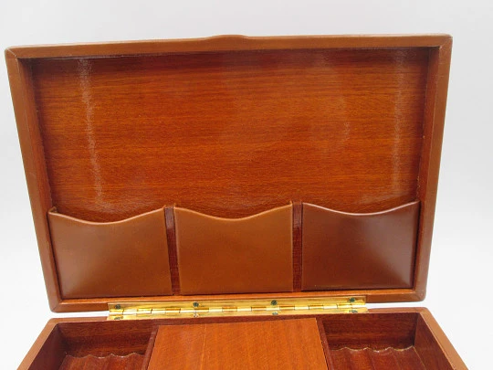Musical tobacco table desk box. Wood and brown leather. Manual wind. Europe. 1970's Musical tobacco table desk box. Wood and brown leather. Manual wind. Europe. 1970's