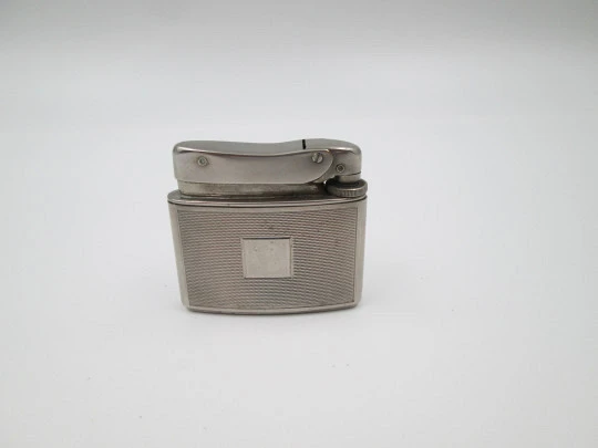 Mylflam Record pocket gas lighter. Silver plated metal. Linear pattern. West Germany