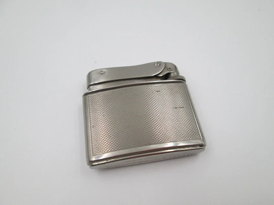 Mylflam Record pocket gas lighter. Silver plated metal. Linear pattern. West Germany