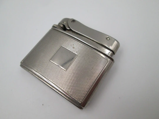 Mylflam Record pocket gas lighter. Silver plated metal. Linear pattern. West Germany