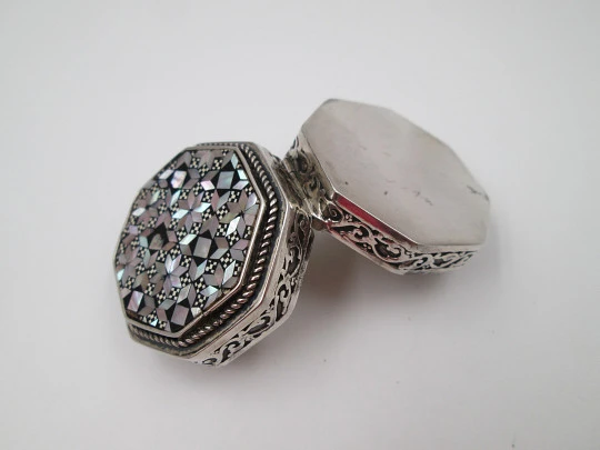 Octagonal pillbox. Sterling silver. Checkered mother-of-pearl front. Vegetable ornates