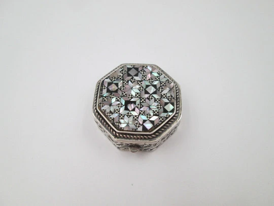 Octagonal pillbox. Sterling silver. Checkered mother-of-pearl front. Vegetable ornates