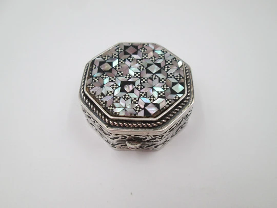 Octagonal pillbox. Sterling silver. Checkered mother-of-pearl front. Vegetable ornates