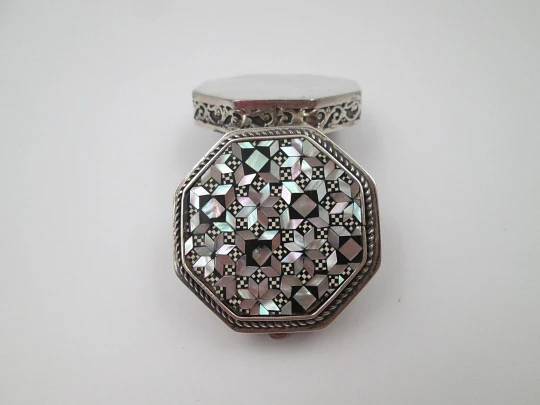 Octagonal pillbox. Sterling silver. Checkered mother-of-pearl front. Vegetable ornates