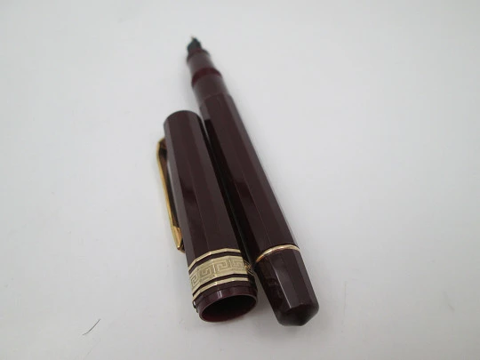 Omas 555 art deco fountain pen. Burgundy faceted resin and gold plated details. 1990's