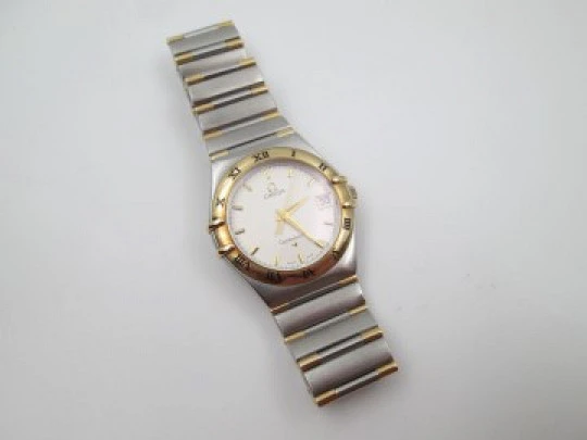 Omega Constellation. Steel & 18k yellow gold. Quartz. Unisex. Calendar. 2000's