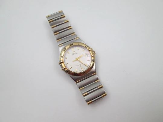 Omega Constellation. Steel & 18k yellow gold. Quartz. Unisex. Calendar. 2000's