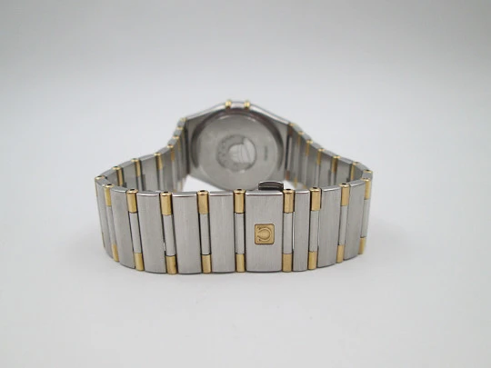 Omega Constellation. Steel & 18k yellow gold. Quartz. Unisex. Calendar. 2000's