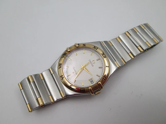 Omega Constellation. Steel & 18k yellow gold. Quartz. Unisex. Calendar. 2000's