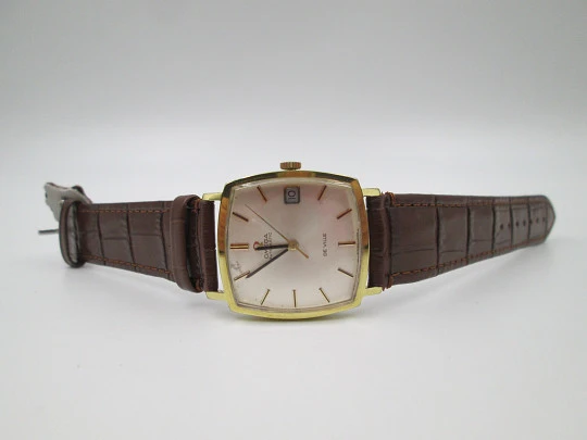 Omega De Ville. Acero y chapado oro. Caja cuadrada. Automático. Correa piel. 1960
