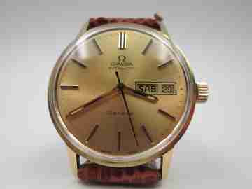 Omega Genève Seamaster. 18 karat gold. Automatic. Date & day. Leather strap