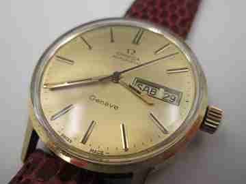 Omega Genève Seamaster. 18 karat gold. Automatic. Date & day. Leather strap