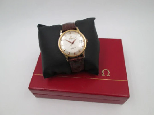 Omega Genève. 20 micron gold plated and steel. Automatic. Strap. Red box. 1960's