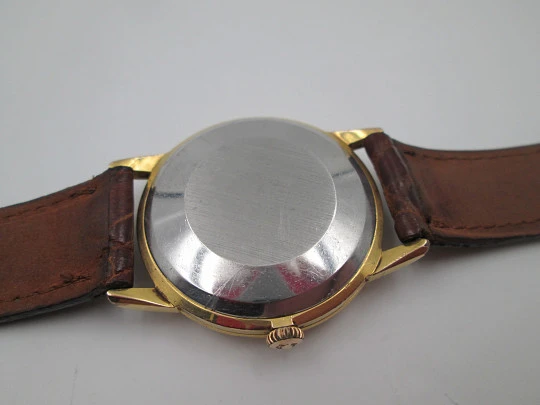 Omega Genève. 20 micron gold plated and steel. Automatic. Strap. Red box. 1960's