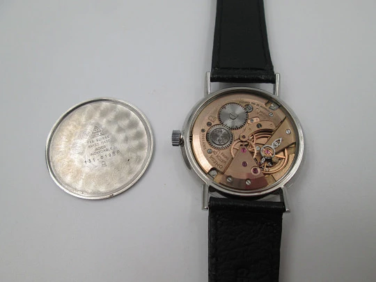 Omega Genève. Acero inoxidable. Cuerda manual. Correa piel negra. Suiza. 1960