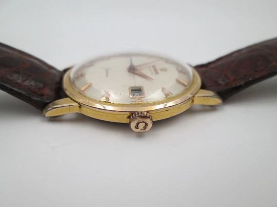 Omega Genève. Chapado oro 20 micras y acero. Automático. Correa. Estuche. 1960