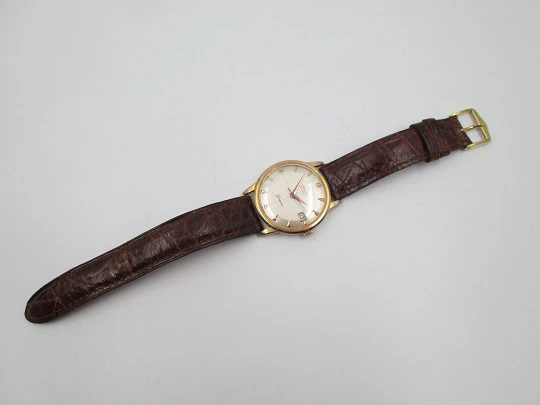 Omega Genève. Chapado oro 20 micras y acero. Automático. Correa. Estuche. 1960