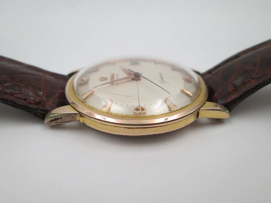 Omega Genève. Chapado oro 20 micras y acero. Automático. Correa. Estuche. 1960