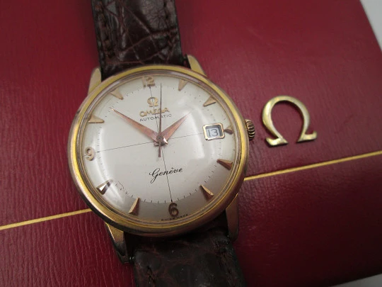 Omega Genève. Chapado oro 20 micras y acero. Automático. Correa. Estuche. 1960