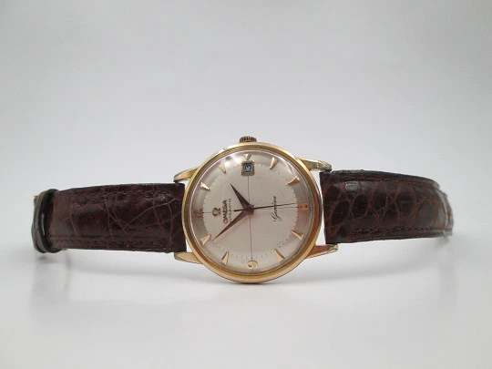 Omega Genève. Chapado oro 20 micras y acero. Automático. Correa. Estuche. 1960