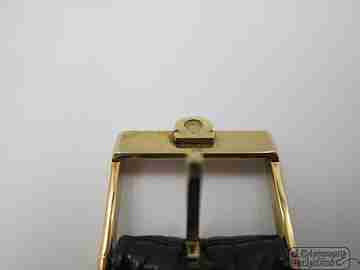 Omega Genève. Chapado oro 20 micras y acero. Cuerda. Dial Ojo Tigre