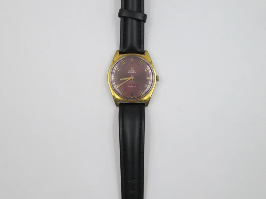 Omega Genève. Stainless steel & gold plated. Automatic. 1970's. Purple dial