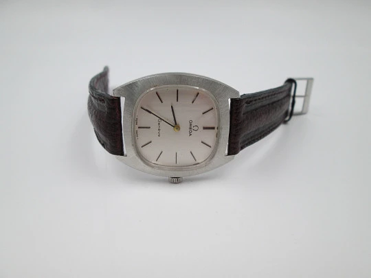 Omega Genève. Stainless steel. 1960's. Manual wind. Square case. Swiss