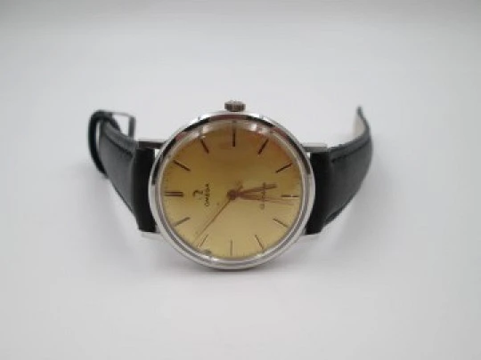 Omega Genève. Stainless steel. Circa 1960's. Manual wind. Black strap