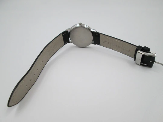 Omega Genève. Stainless steel. Circa 1960's. Manual wind. Black strap